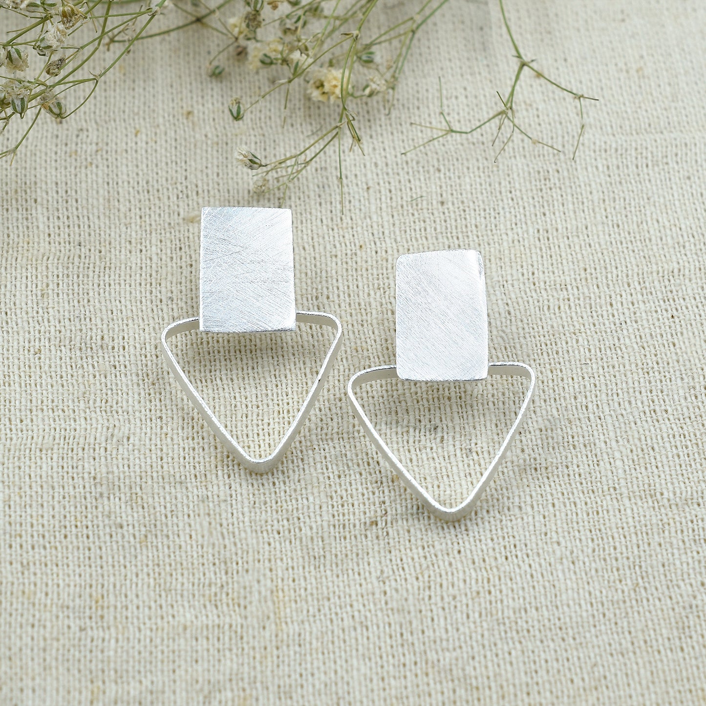 Square Holding Triangle Stud Earrings