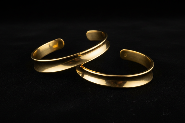 make a brass mordern armcuffs with black background 